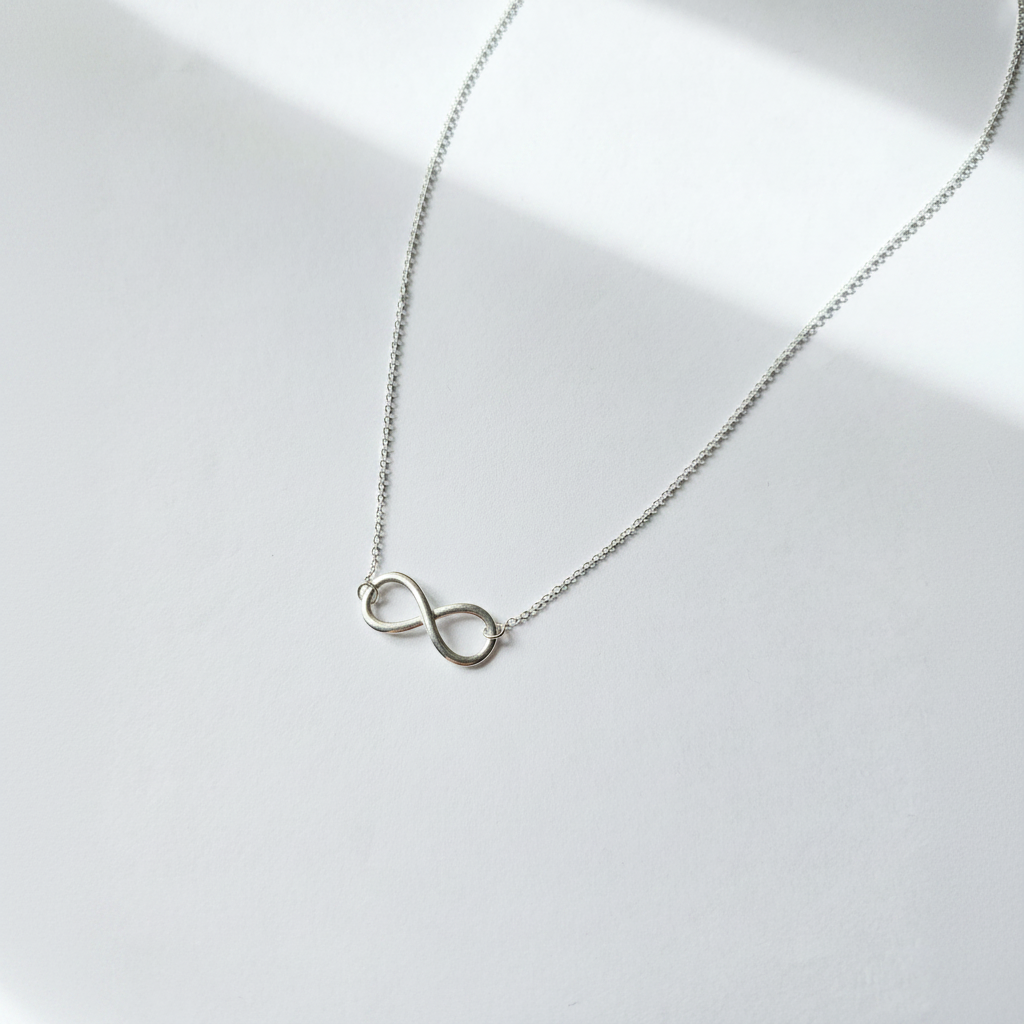 Clean white background infinity necklace