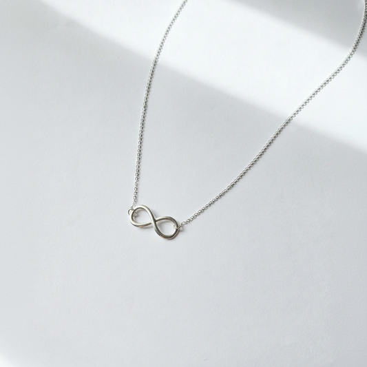 Clean white background infinity necklace