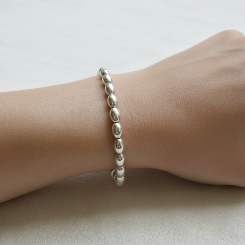 Natural Silver Bead Bracelet on Woman's Wrist